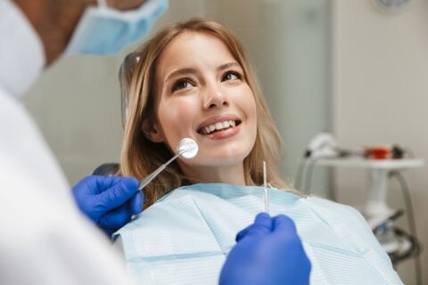 Patient smiling during a dental check-up.