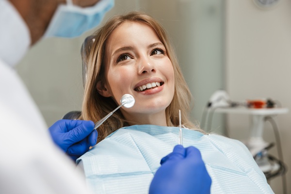 Patient smiling during a dental check-up.